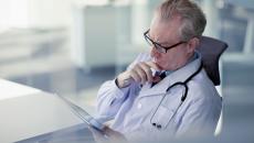 Healthcare provider looking at a tablet