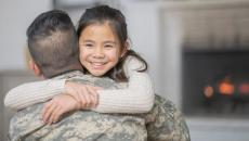 Veteran and a child hugging