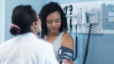 A provider checking blood pressure during an appointment